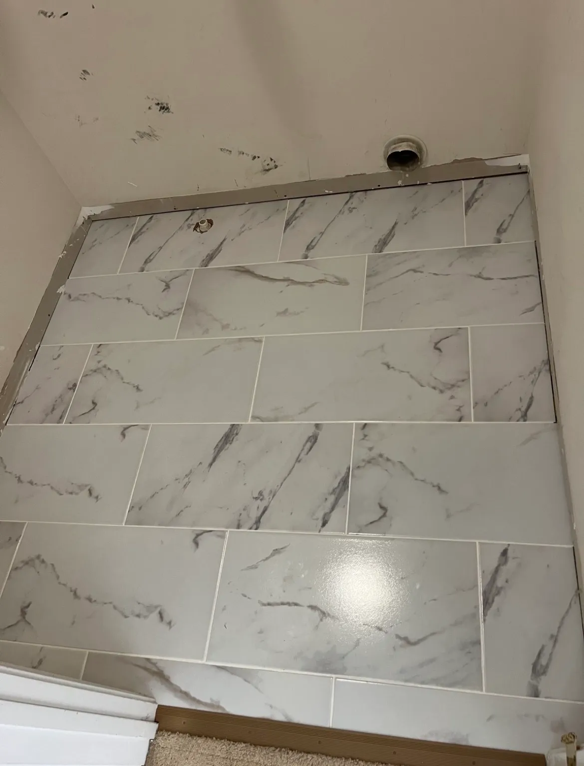 Real tile installation project with marble-look wall tiles